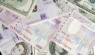 Dollar holds steady as sterling slips on political uncertainty